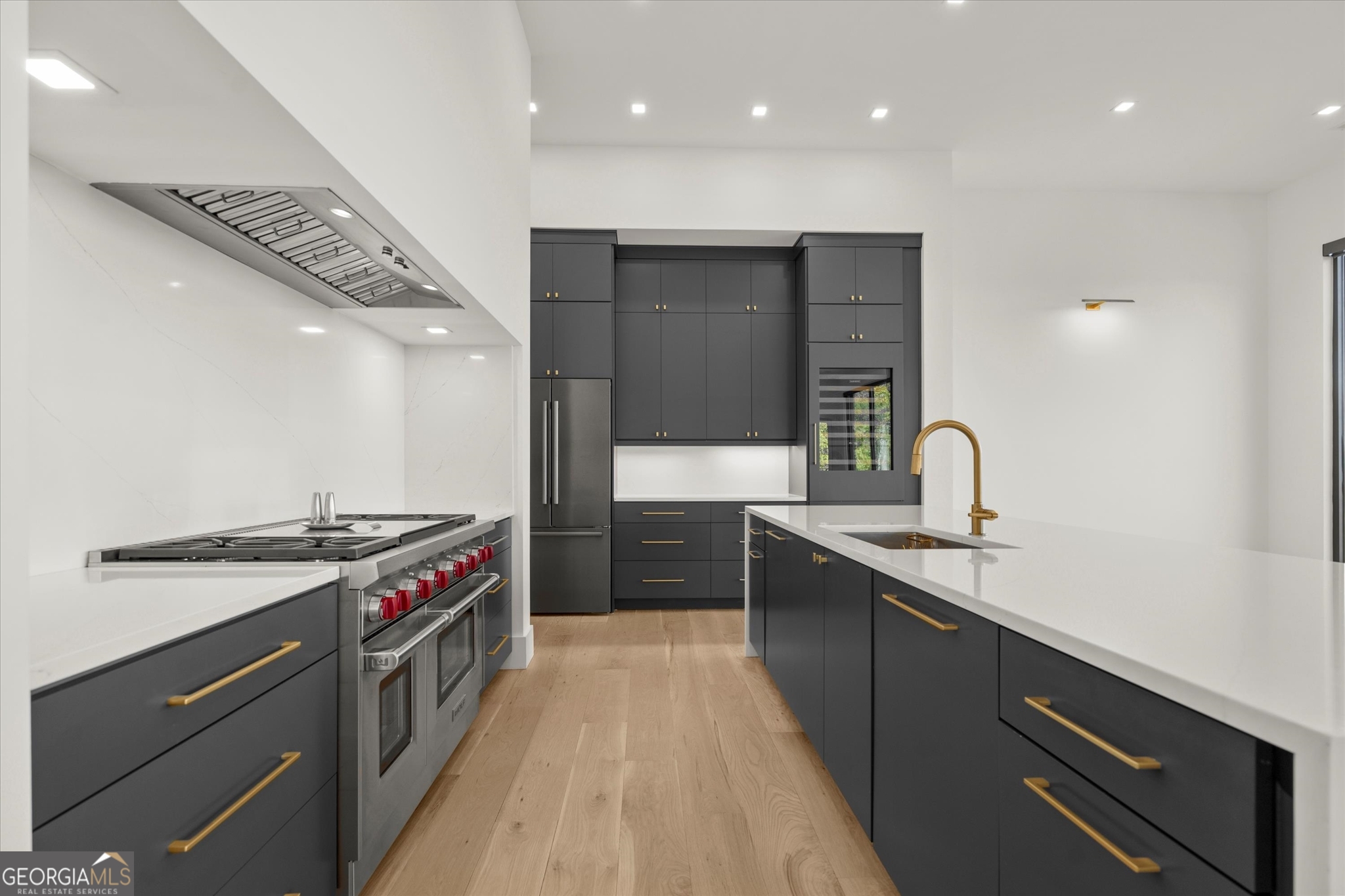 1572 Parker Holifield Road Tiger, GA 30576 - Photo 32 of 84 a kitchen with stainless steel appliances granite countertop a sink a stove and a wooden floors