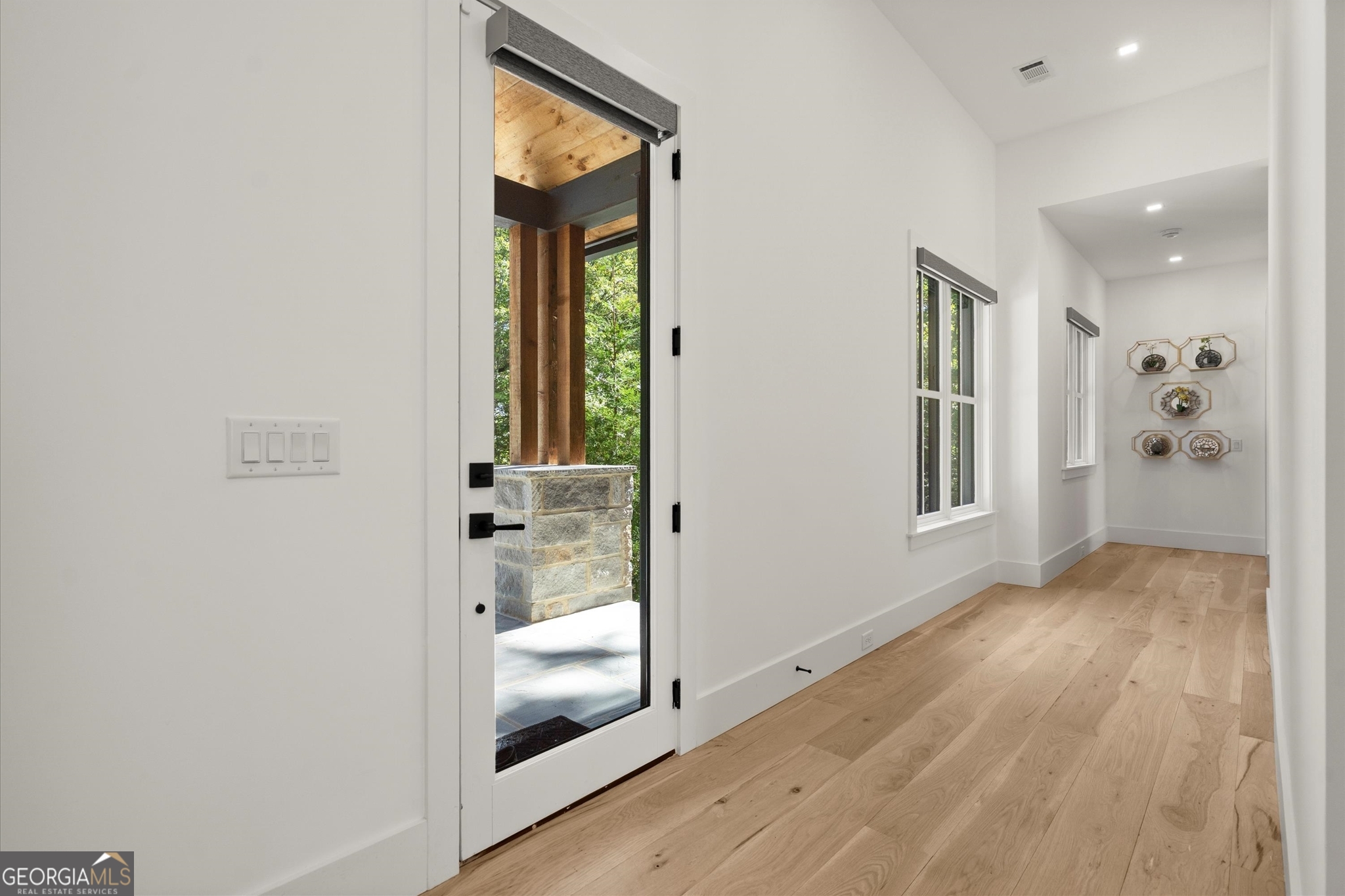 1572 Parker Holifield Road Tiger, GA 30576 - Photo 37 of 84 a view of a hallway with wooden floor and a living room