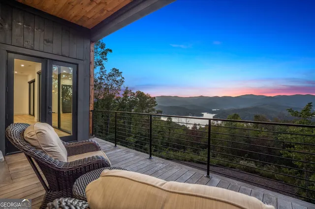a view of a backyard with sitting area