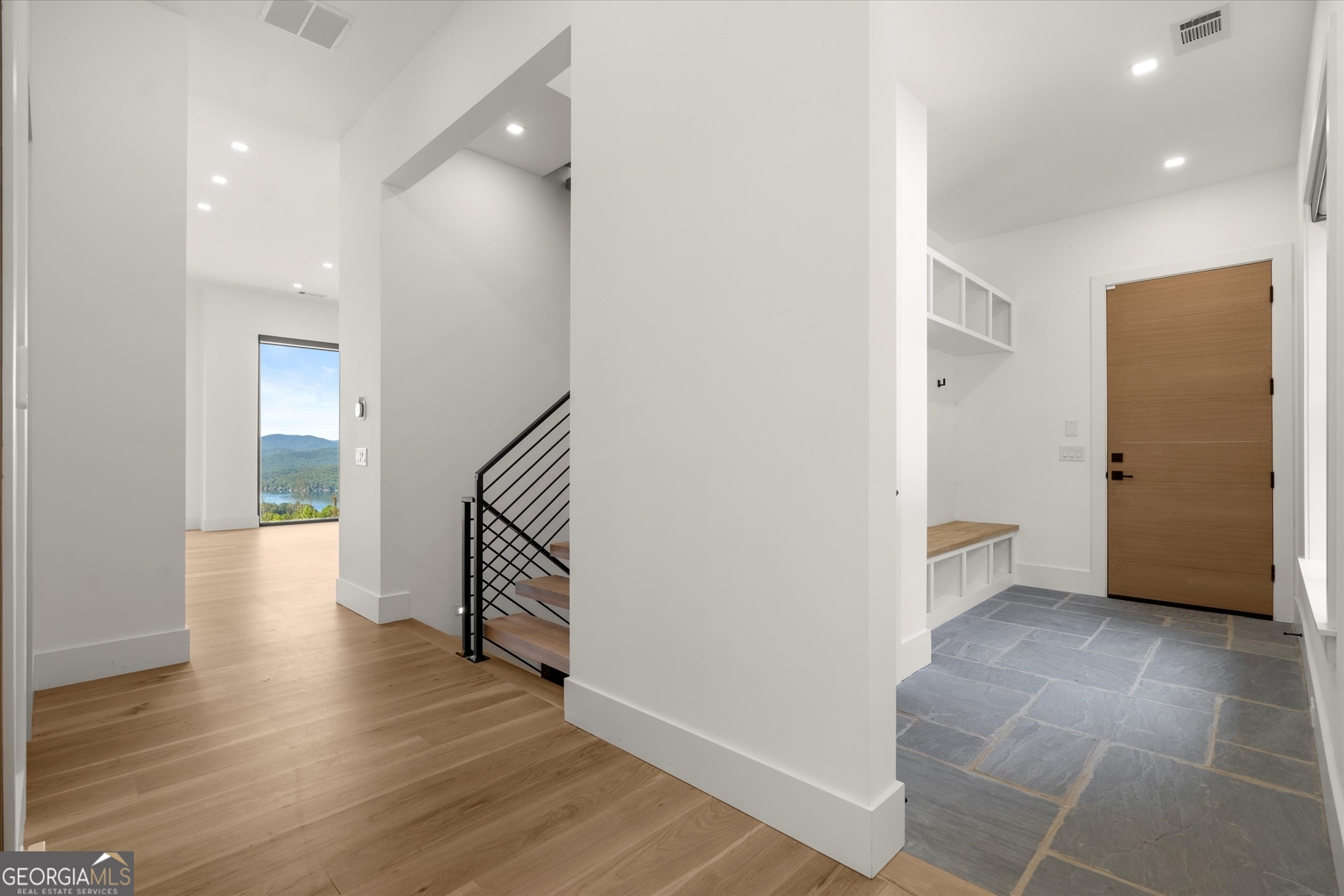 1572 Parker Holifield Road Tiger, GA 30576 - Photo 50 of 84 a view of an empty room with wooden floor and a bathroom