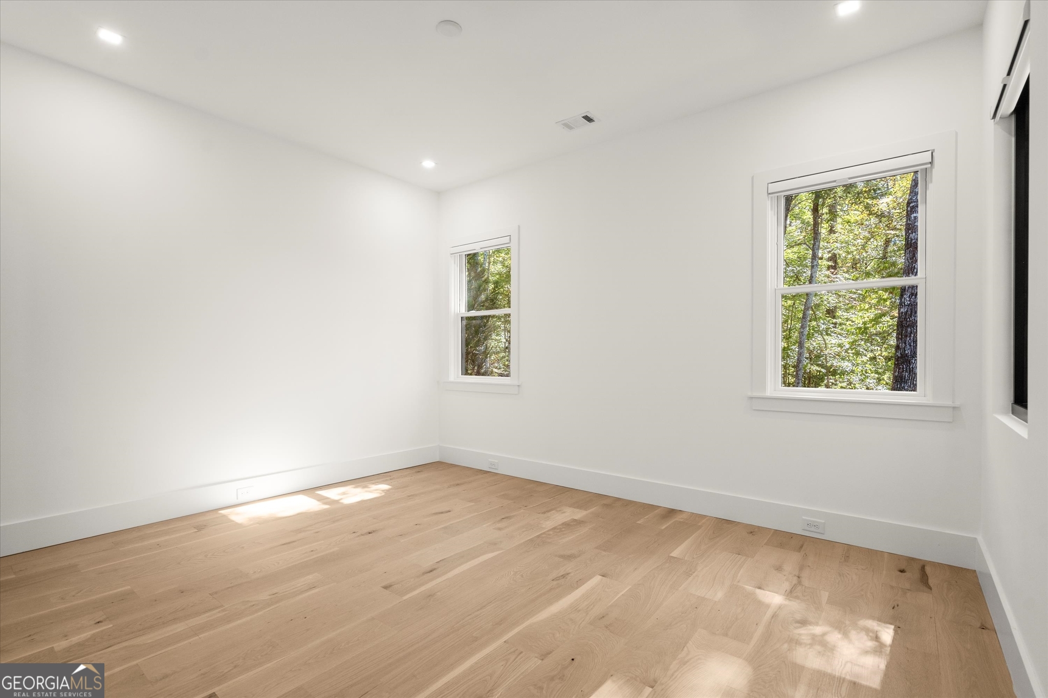 1572 Parker Holifield Road Tiger, GA 30576 - Photo 59 of 84 an empty room with wooden floor and windows