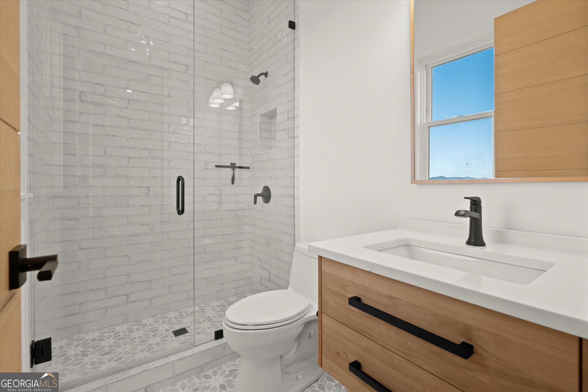 1572 Parker Holifield Road Tiger, GA 30576 - Photo 68 of 84 a bathroom with a granite countertop sink a toilet and shower