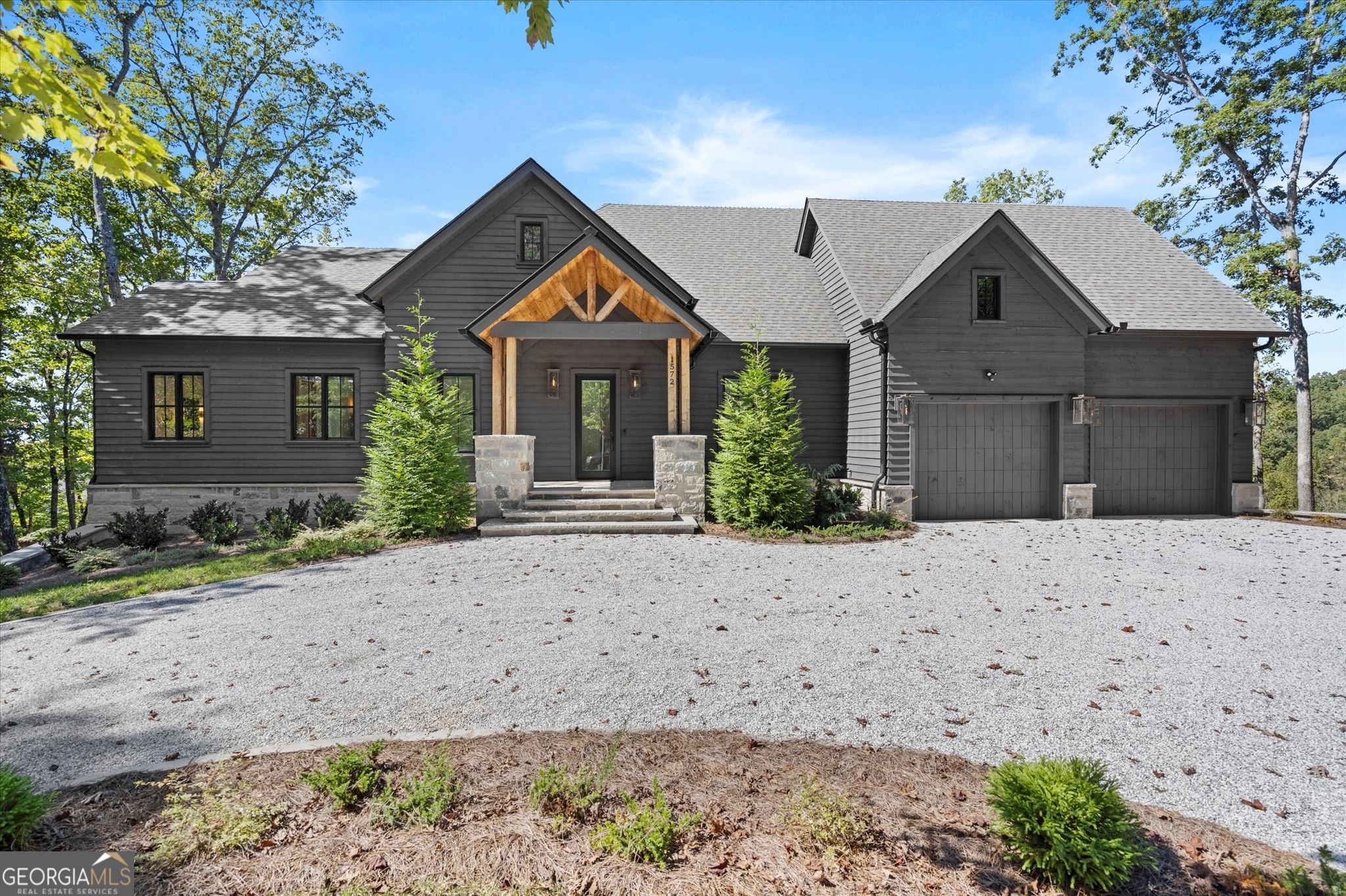 1572 Parker Holifield Road Tiger, GA 30576 - Photo 84 of 84 a front view of a house with a yard and garage