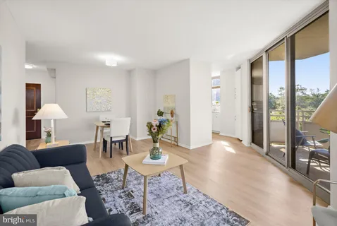 a lobby with furniture and window