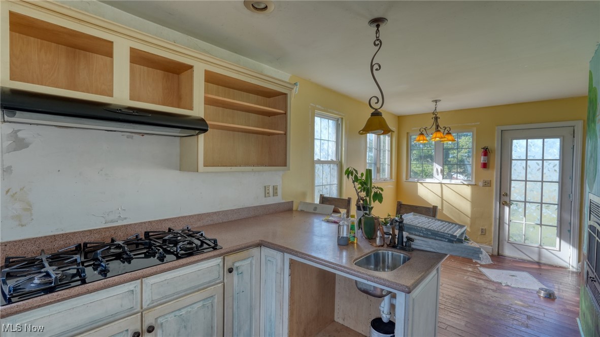 4896 High Hill Road Cambridge, OH 43725 - Photo 12 of 48 Kitchen featuring black gas cooktop and a peninsula