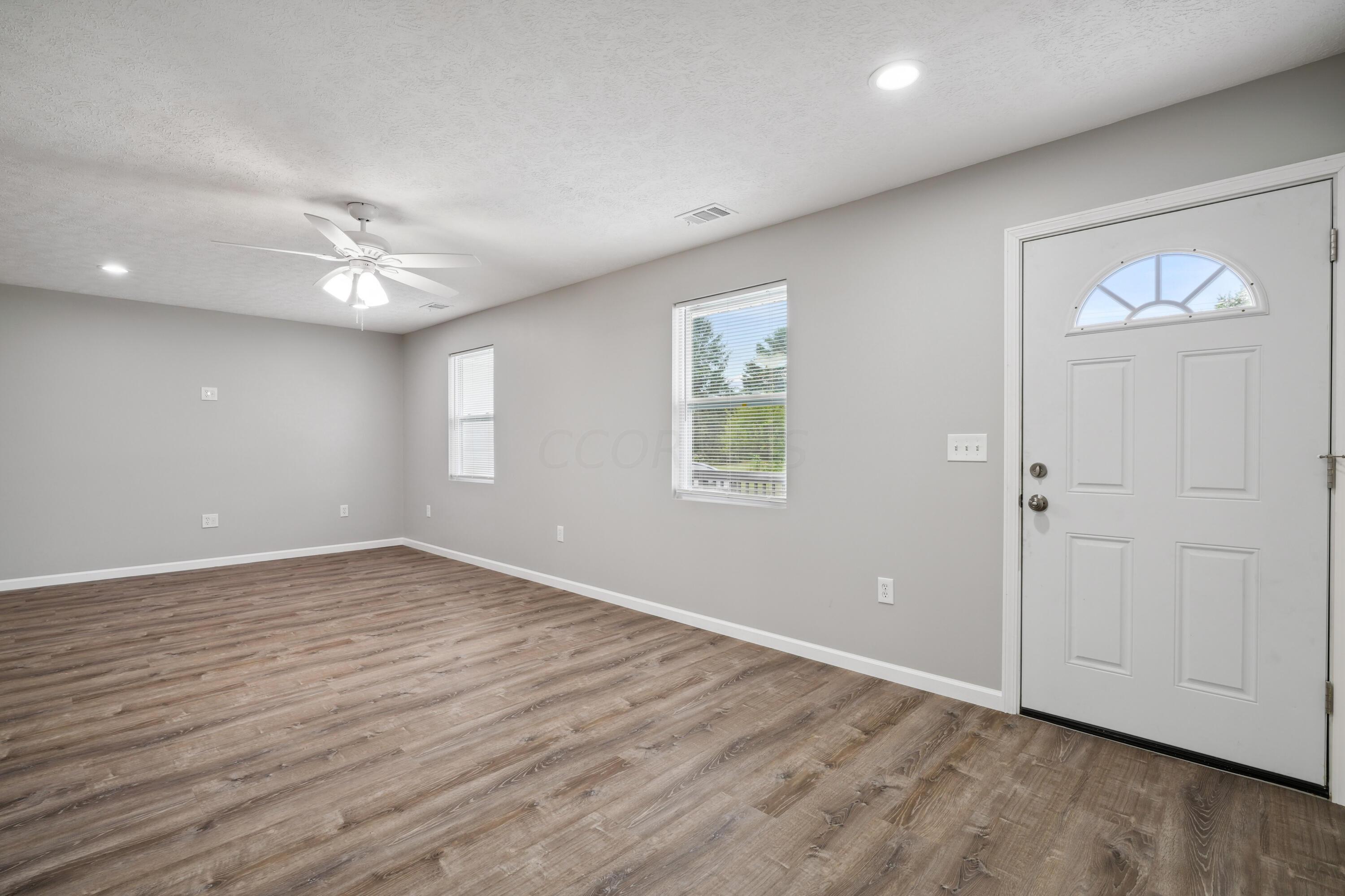 6705 Johnson Road Galloway, OH 43119 - Photo 4 of 30 Large Living Room with luxury vinyl flooring!