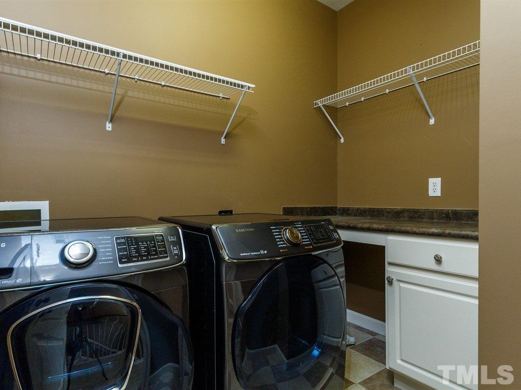 2233 Dunlin Lane Raleigh, NC 27614 - Photo 21 of 24 a utility room with dryer and washer