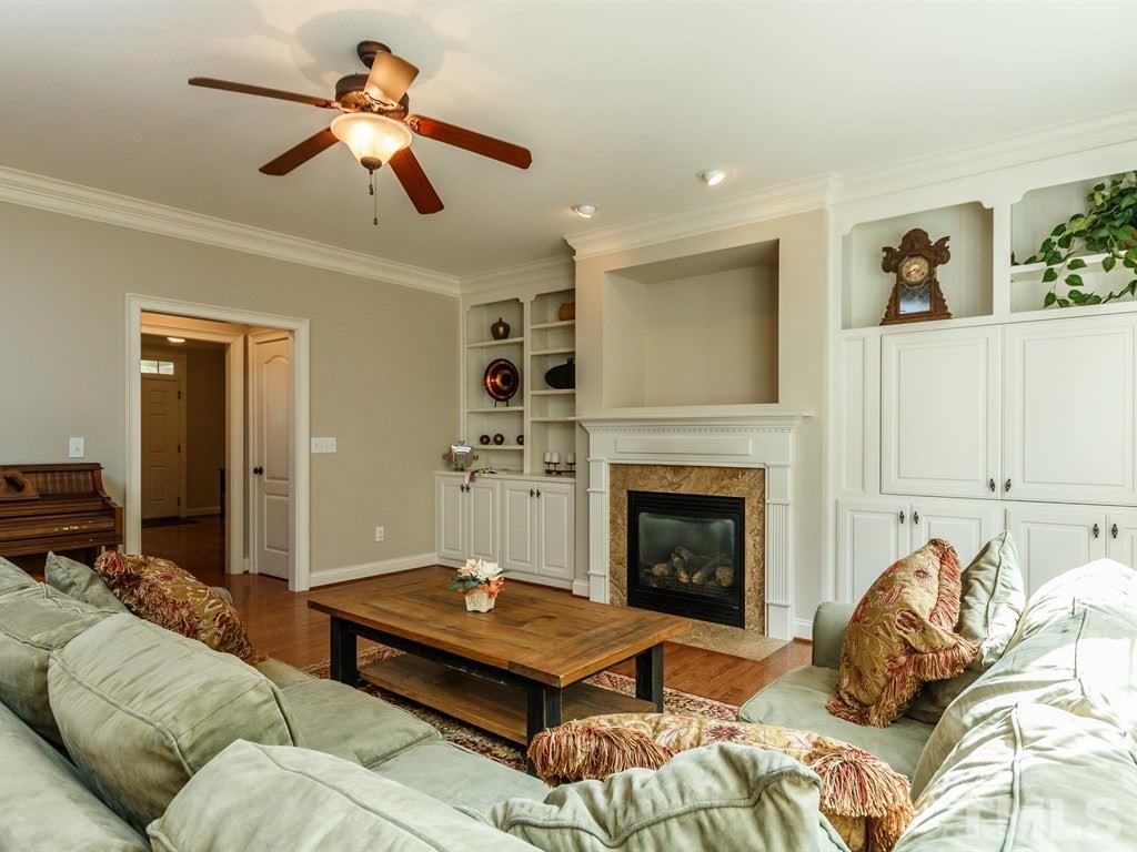2233 Dunlin Lane Raleigh, NC 27614 - Photo 6 of 24 a living room with furniture and a fireplace