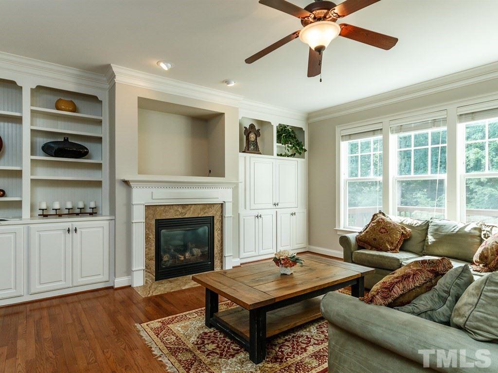 2233 Dunlin Lane Raleigh, NC 27614 - Photo 7 of 24 a living room with furniture fireplace and window
