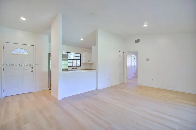 a view of an empty room and window in a room