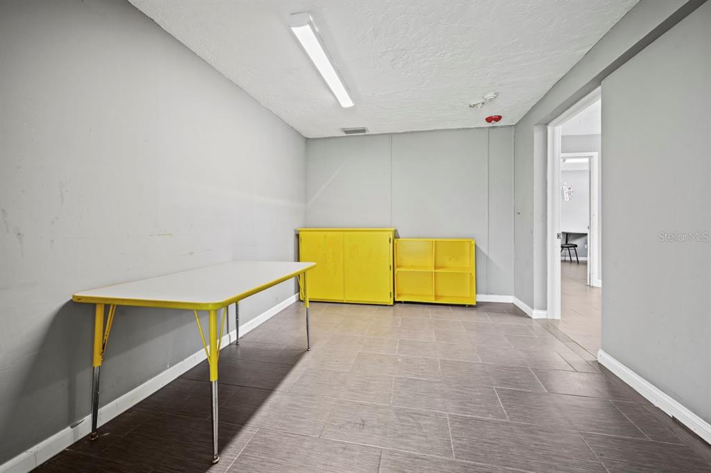 101 St Andrews Boulevard Naples, FL 34113 - Photo 14 of 34 a view of an empty room with a window