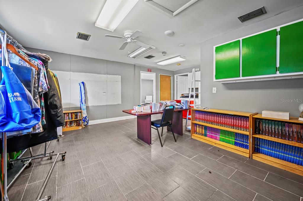 101 St Andrews Boulevard Naples, FL 34113 - Photo 16 of 34 a living room with furniture and a flat screen tv