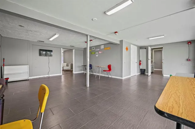 a view of a garage with rack and bicycle