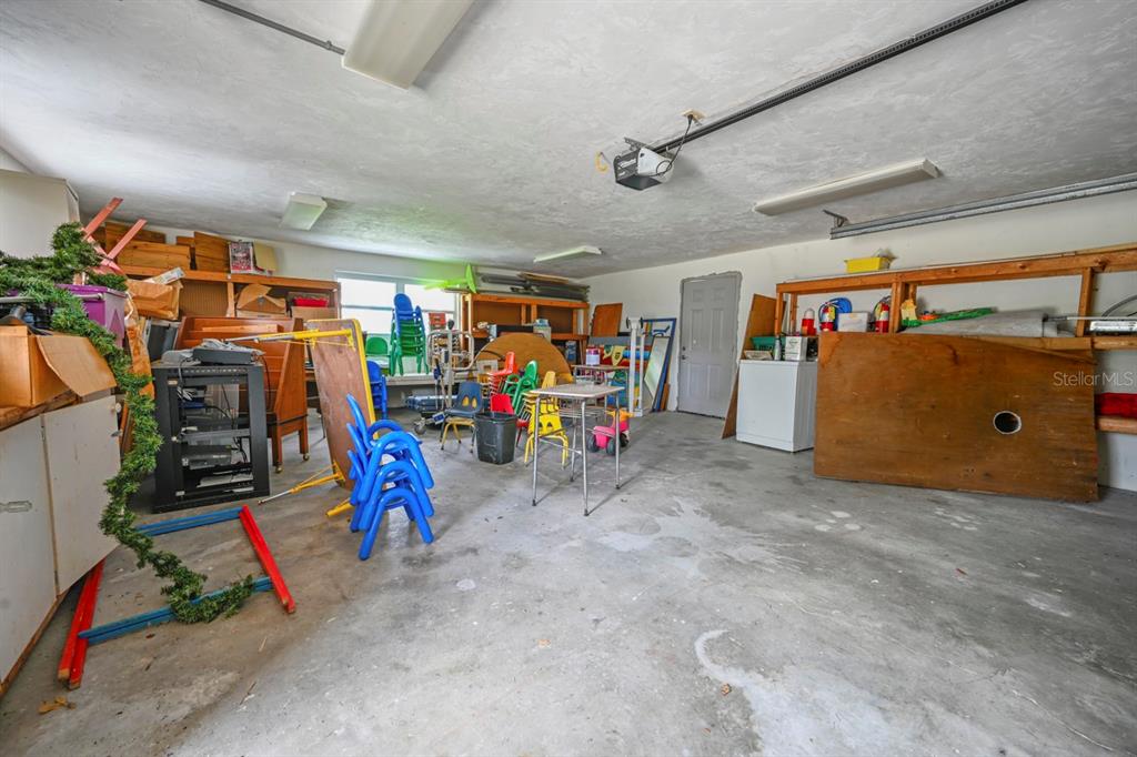 101 St Andrews Boulevard Naples, FL 34113 - Photo 21 of 34 a view of a garage with rack and bicycle