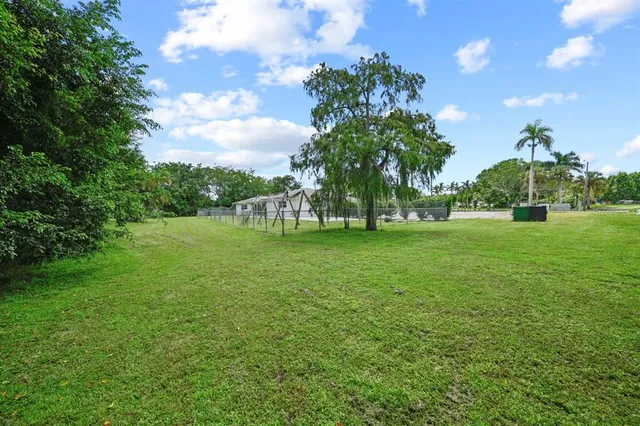 a view of a pathway with a garden