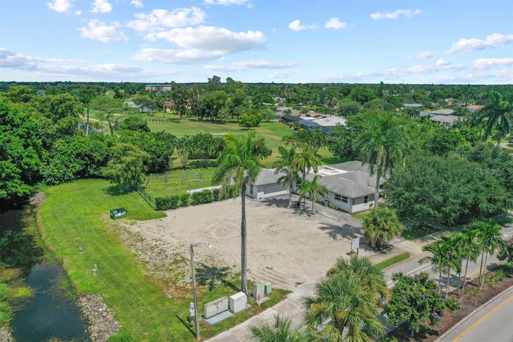 101 St Andrews Boulevard Naples, FL 34113 - Photo 32 of 34 a view of a pathway with a garden