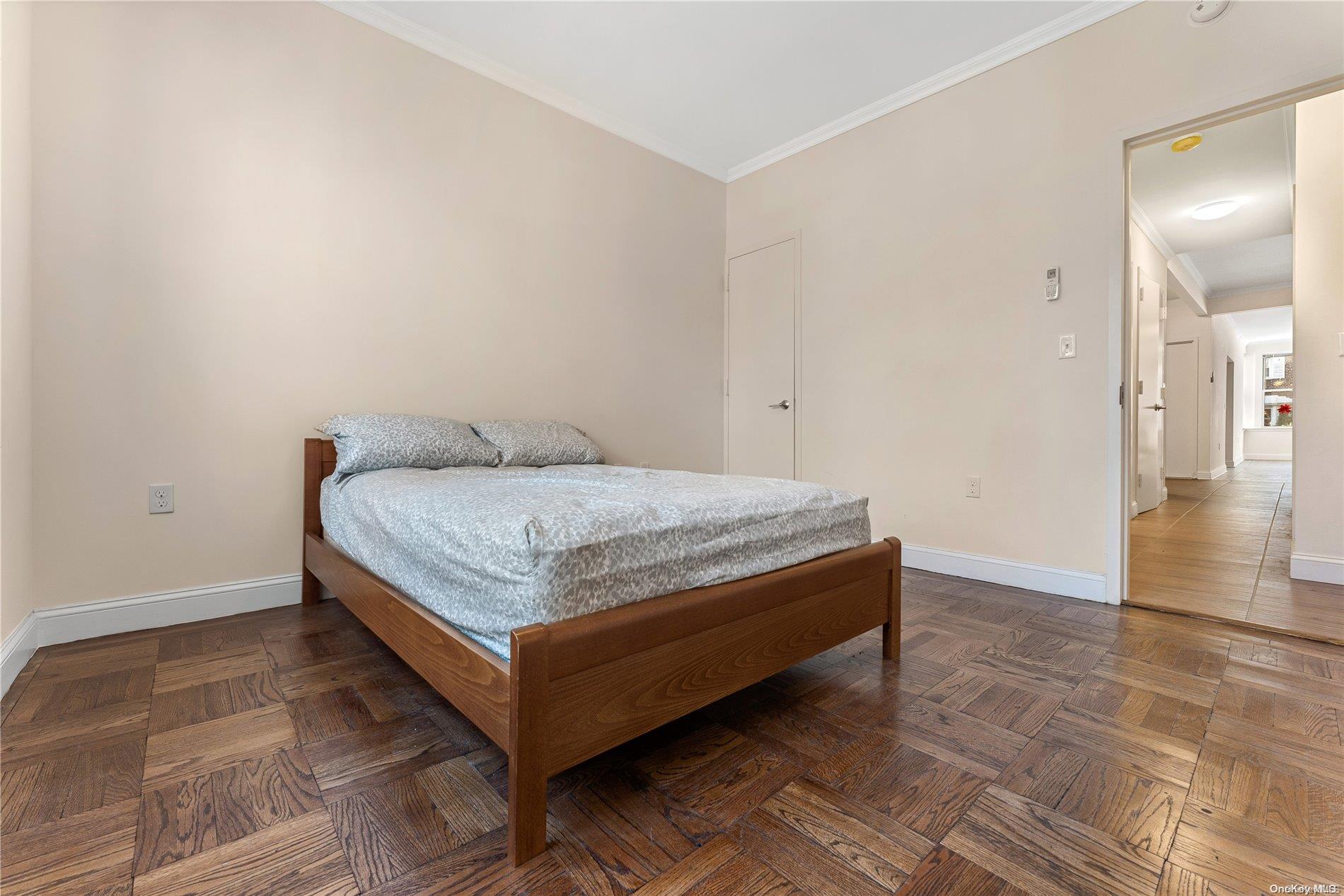 5112 Post Road Bronx, NY 10471 - Photo 14 of 35 a bedroom with a bed and wooden floor