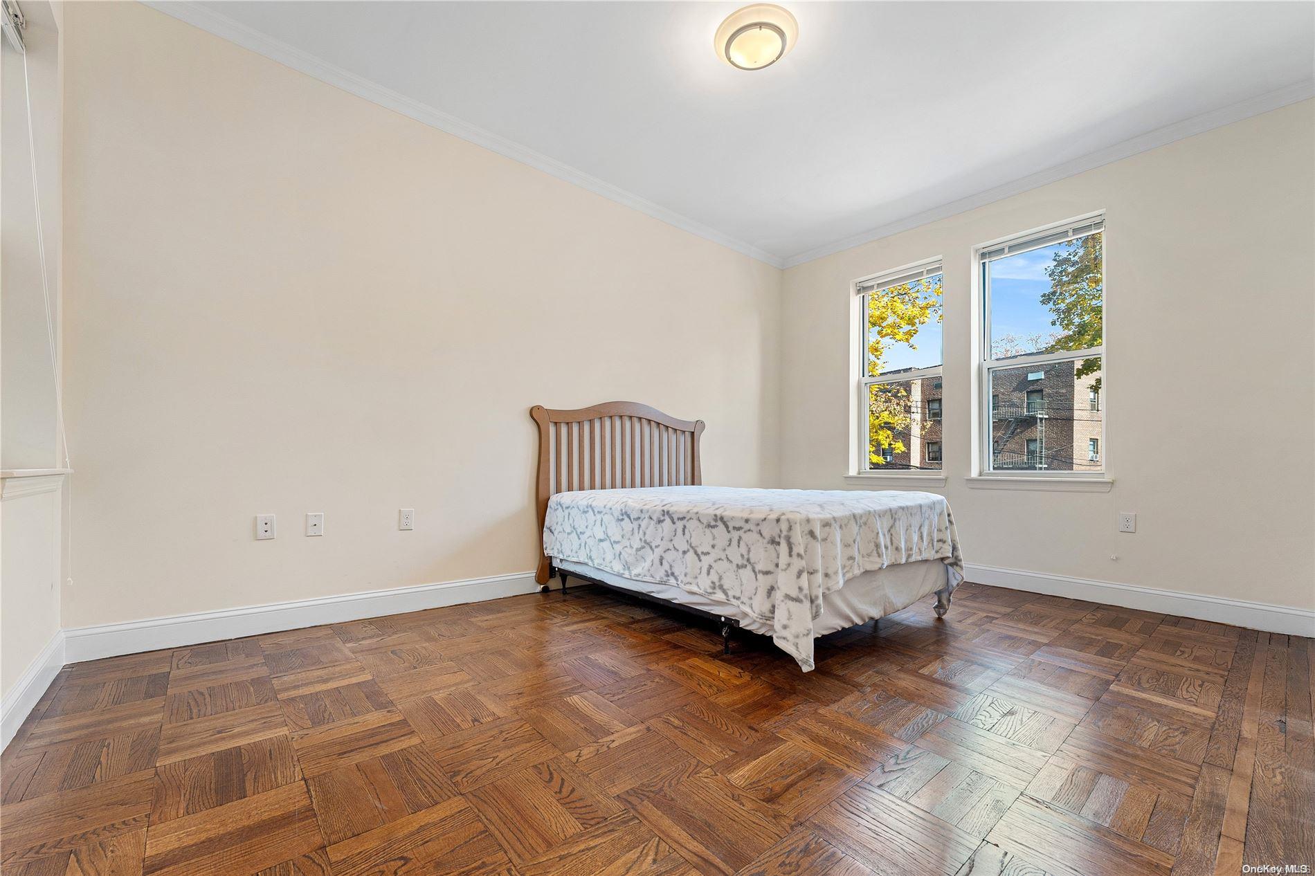 5112 Post Road Bronx, NY 10471 - Photo 16 of 35 a bedroom with a bed and wooden floor