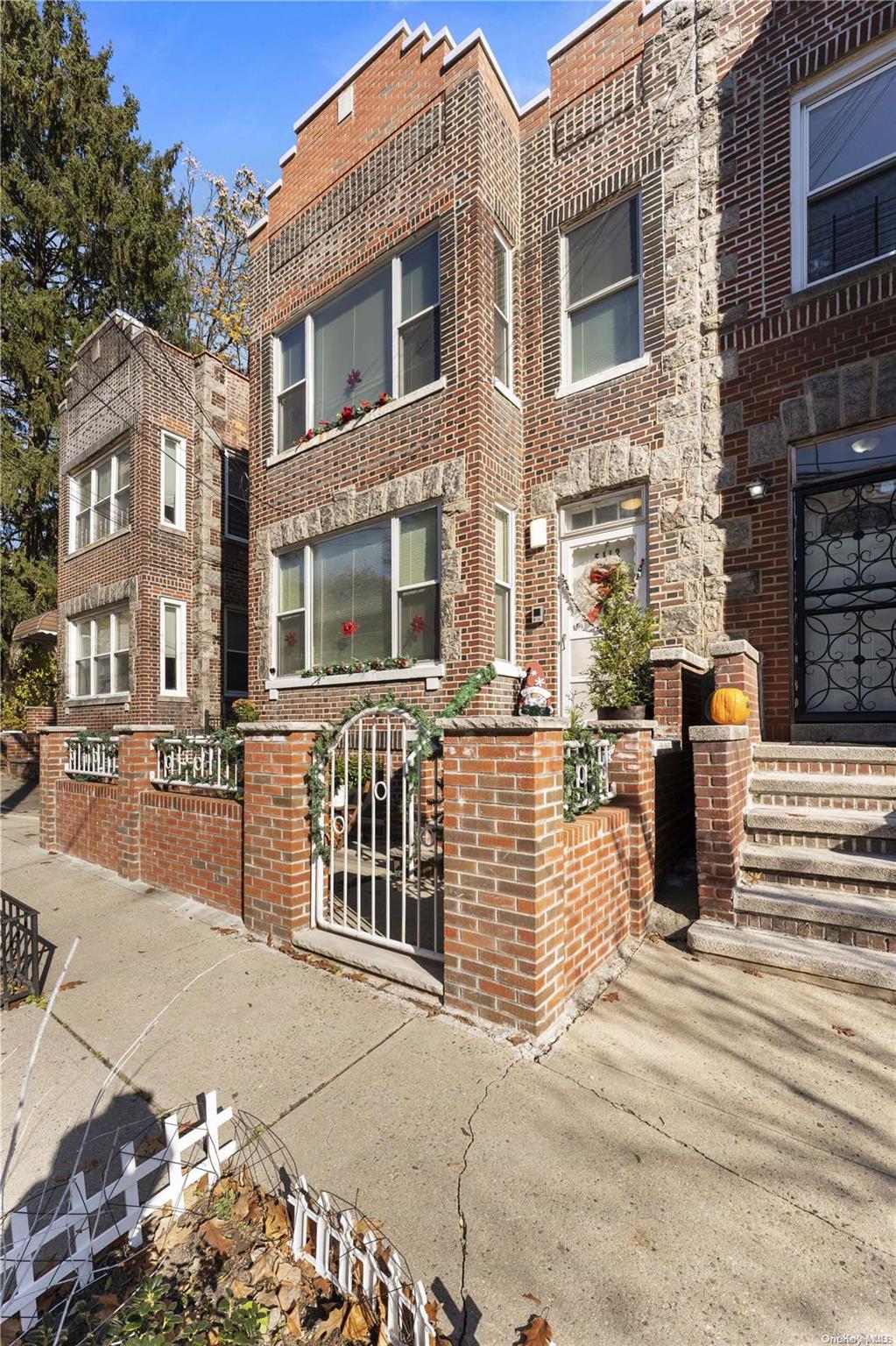 5112 Post Road Bronx, NY 10471 - Photo 2 of 35 a view of a brick building with many windows