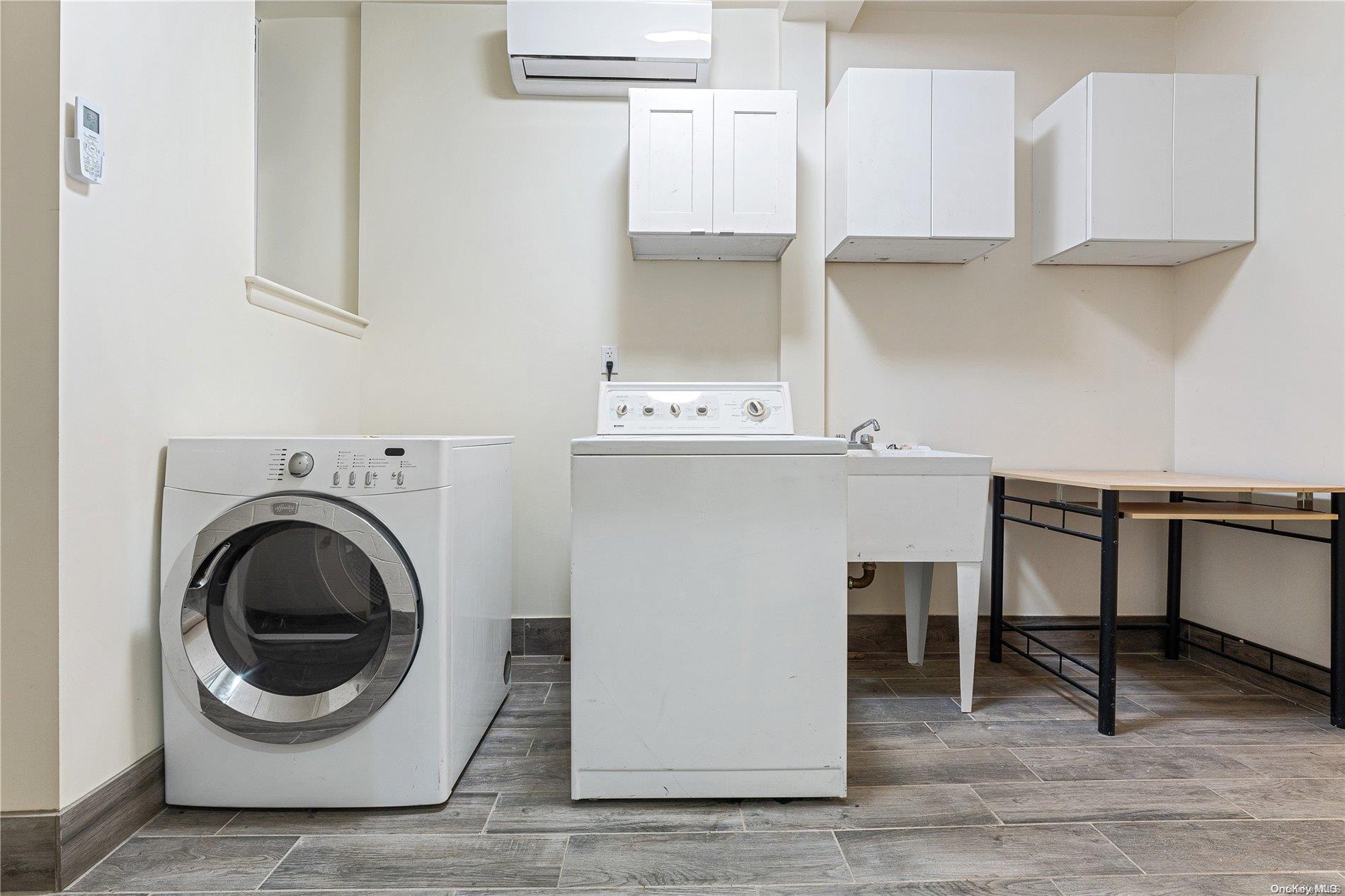5112 Post Road Bronx, NY 10471 - Photo 21 of 35 a utility room with sink dryer and washer