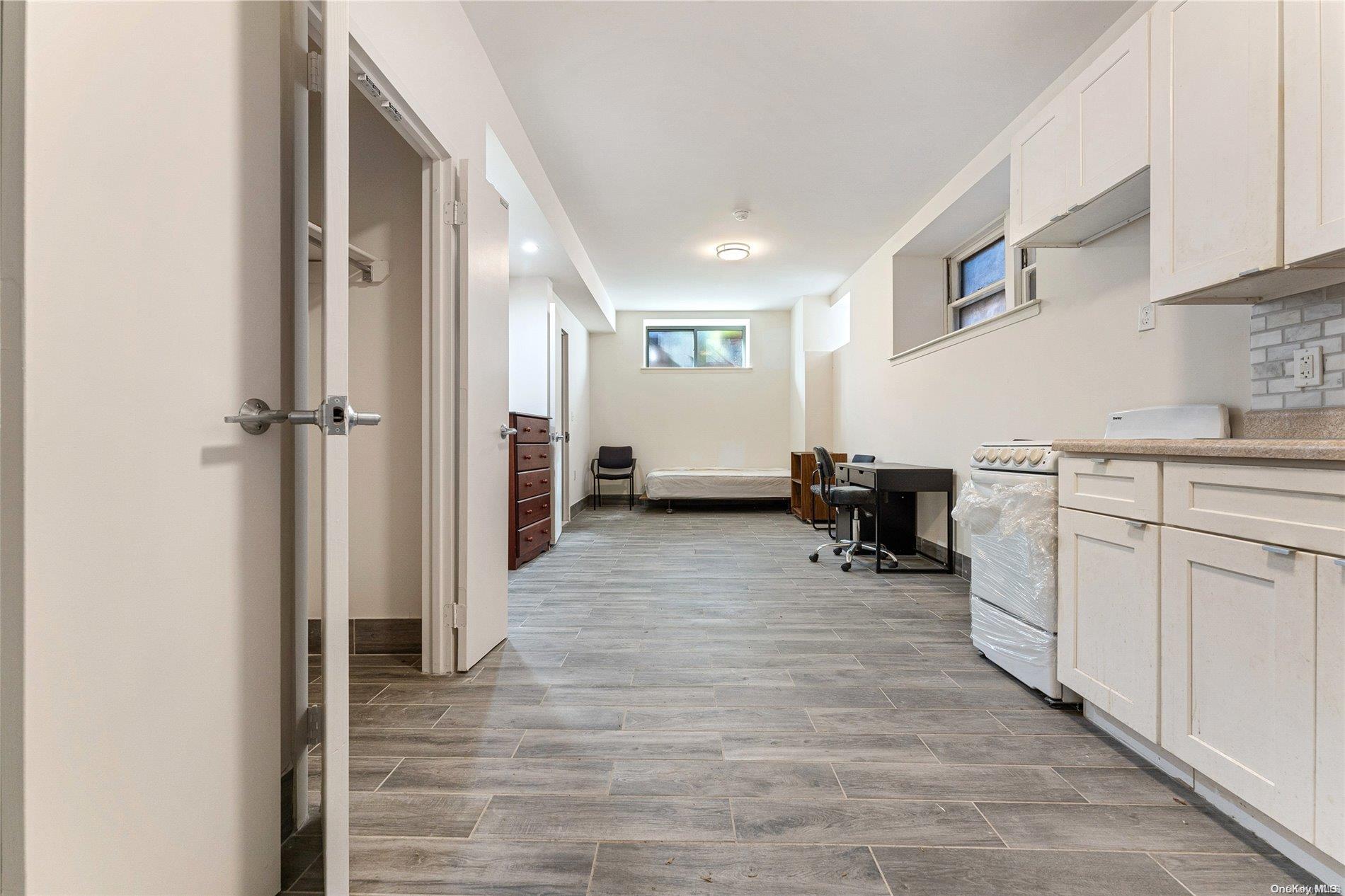5112 Post Road Bronx, NY 10471 - Photo 23 of 35 a kitchen with cabinets and chairs