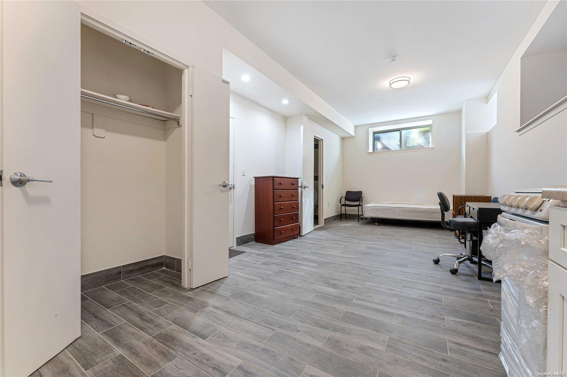 5112 Post Road Bronx, NY 10471 - Photo 24 of 35 a view of a livingroom with hardwood and workspace