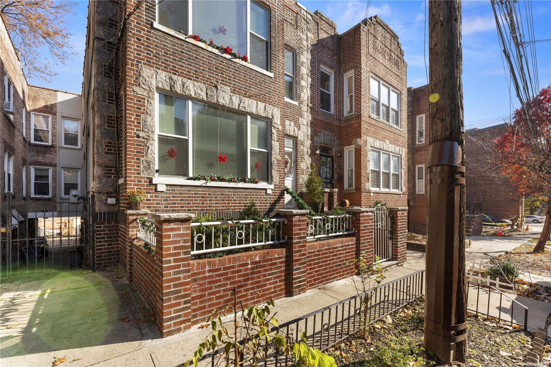 5112 Post Road Bronx, NY 10471 - Photo 3 of 35 an front view of a residential apartment building with a yard