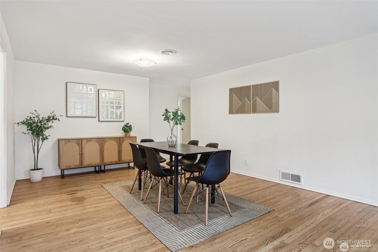 3532 Northeast 97th Street Seattle, WA 98115 - Photo 11 of 27 a view of a dining room with furniture and wooden floor