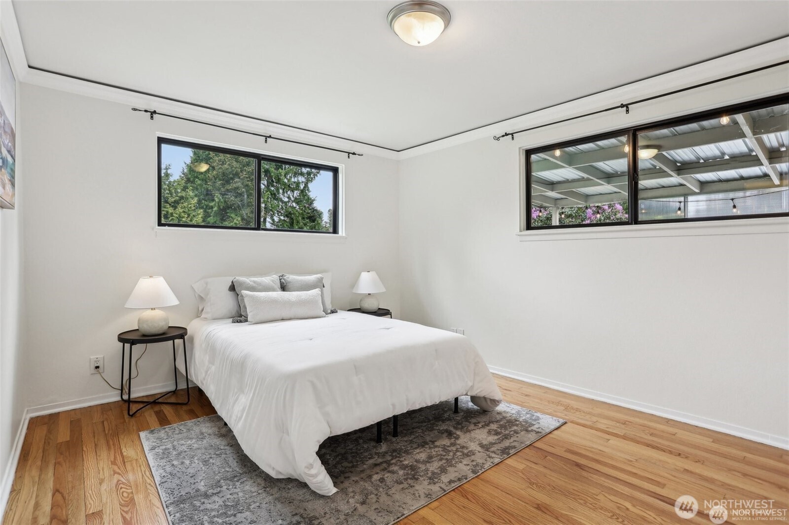 3532 Northeast 97th Street Seattle, WA 98115 - Photo 12 of 27 a bedroom with a bed and a window