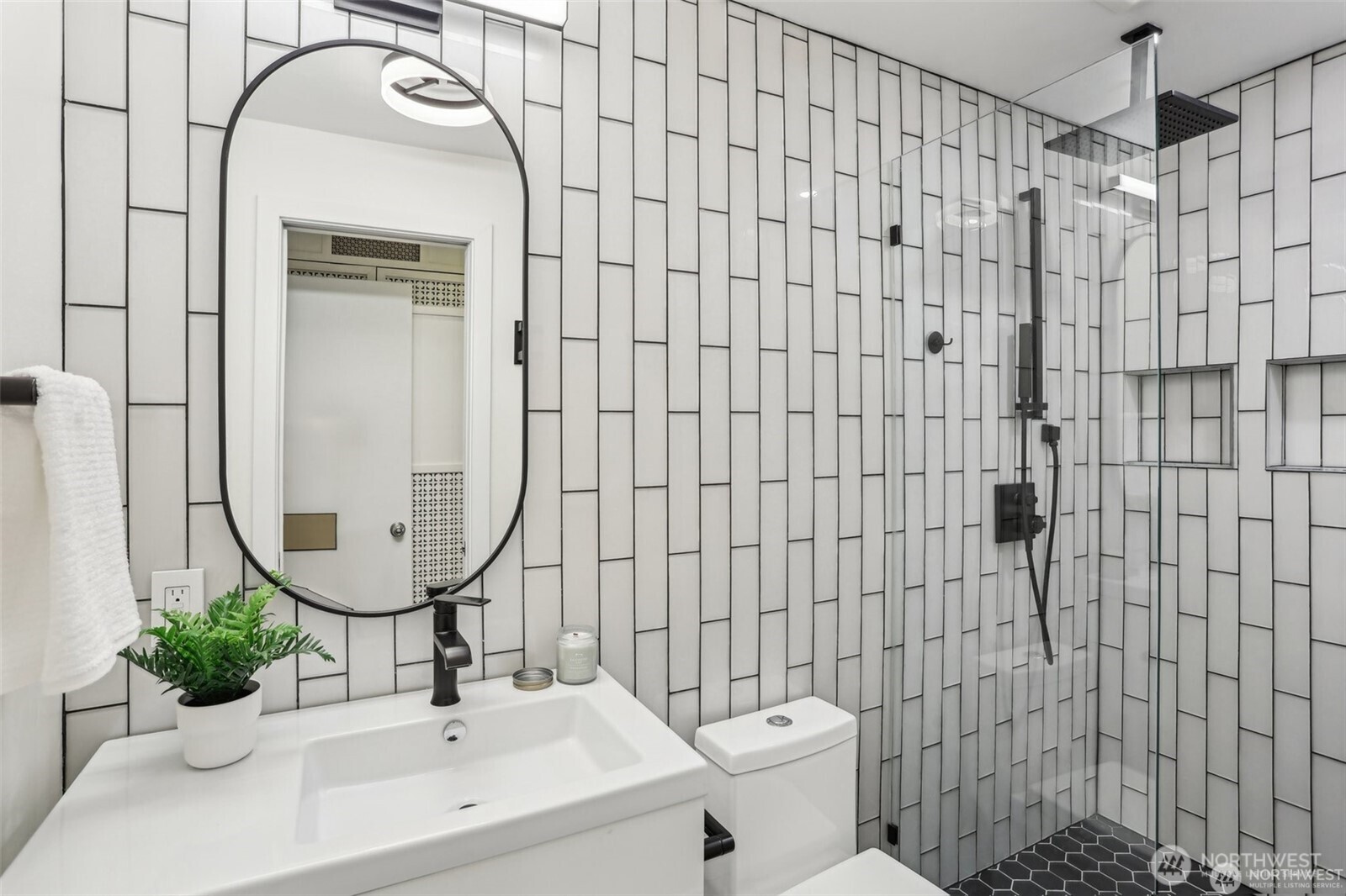 3532 Northeast 97th Street Seattle, WA 98115 - Photo 14 of 27 a bathroom with a sink mirror toilet and shower