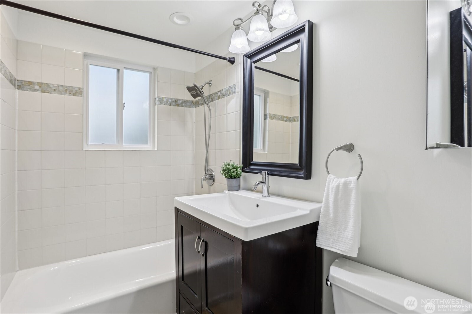 3532 Northeast 97th Street Seattle, WA 98115 - Photo 17 of 27 a bathroom with a sink and a mirror