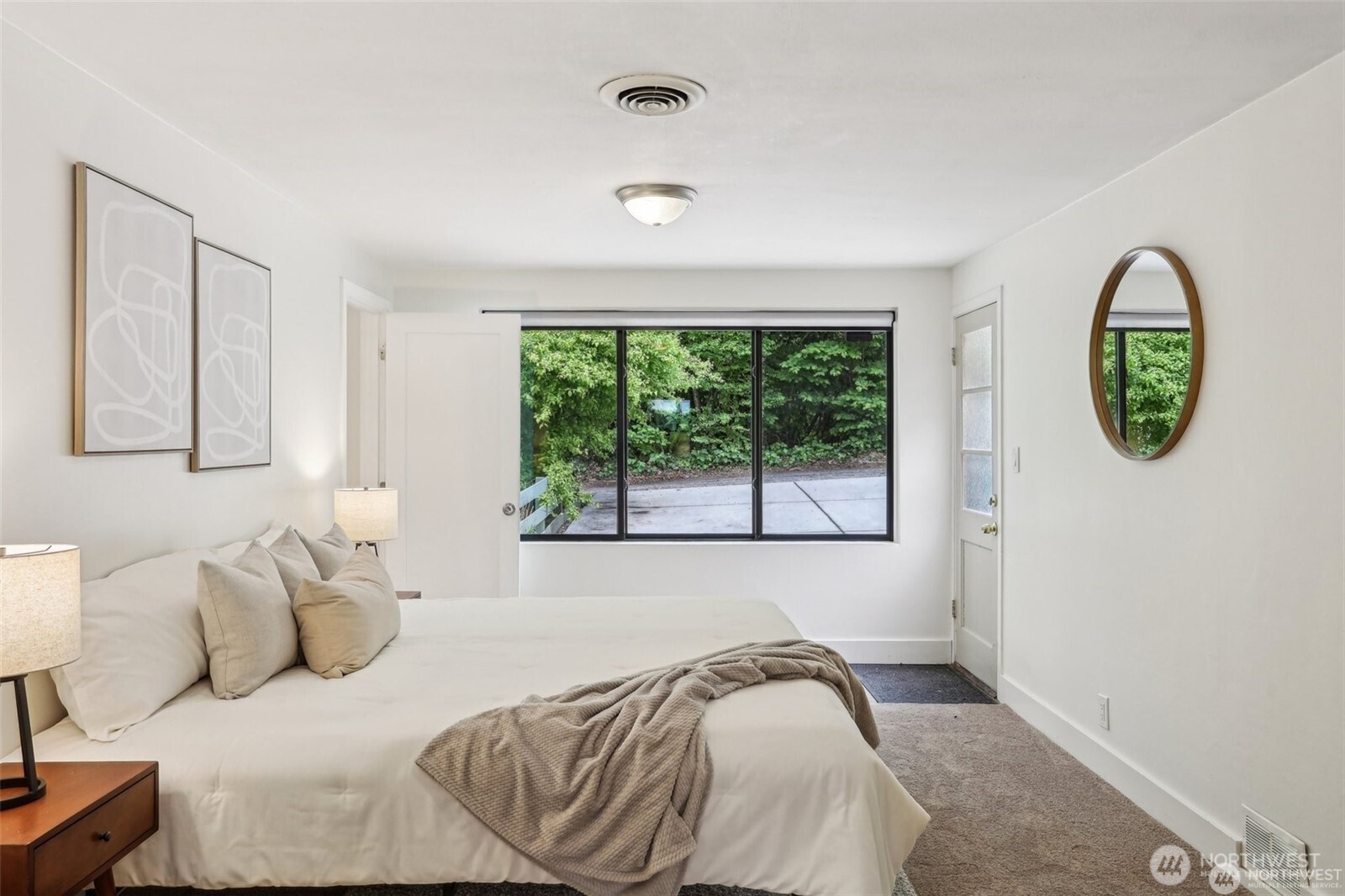 3532 Northeast 97th Street Seattle, WA 98115 - Photo 18 of 27 a bedroom with a bed and a window