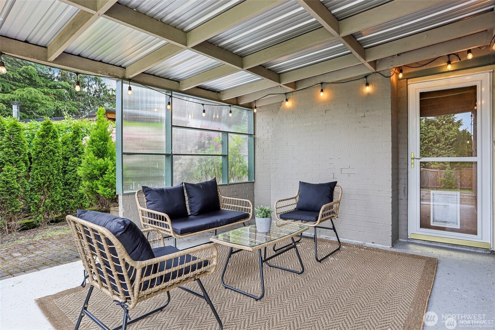 3532 Northeast 97th Street Seattle, WA 98115 - Photo 22 of 27 a living room with patio furniture and a potted plant