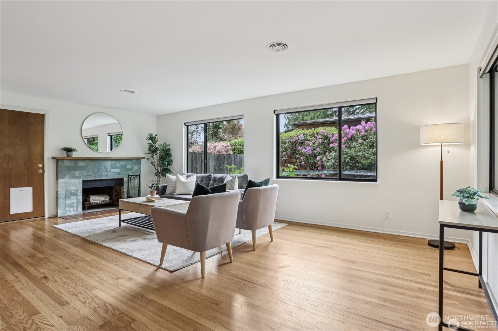 3532 Northeast 97th Street Seattle, WA 98115 - Photo 4 of 27 a living room with furniture a fireplace and a large window