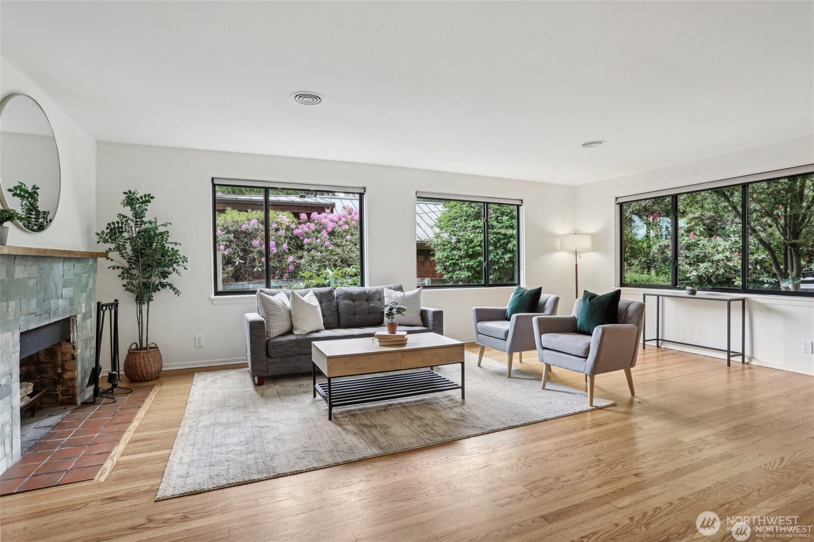 3532 Northeast 97th Street Seattle, WA 98115 - Photo 6 of 27 a living room with furniture and a fireplace