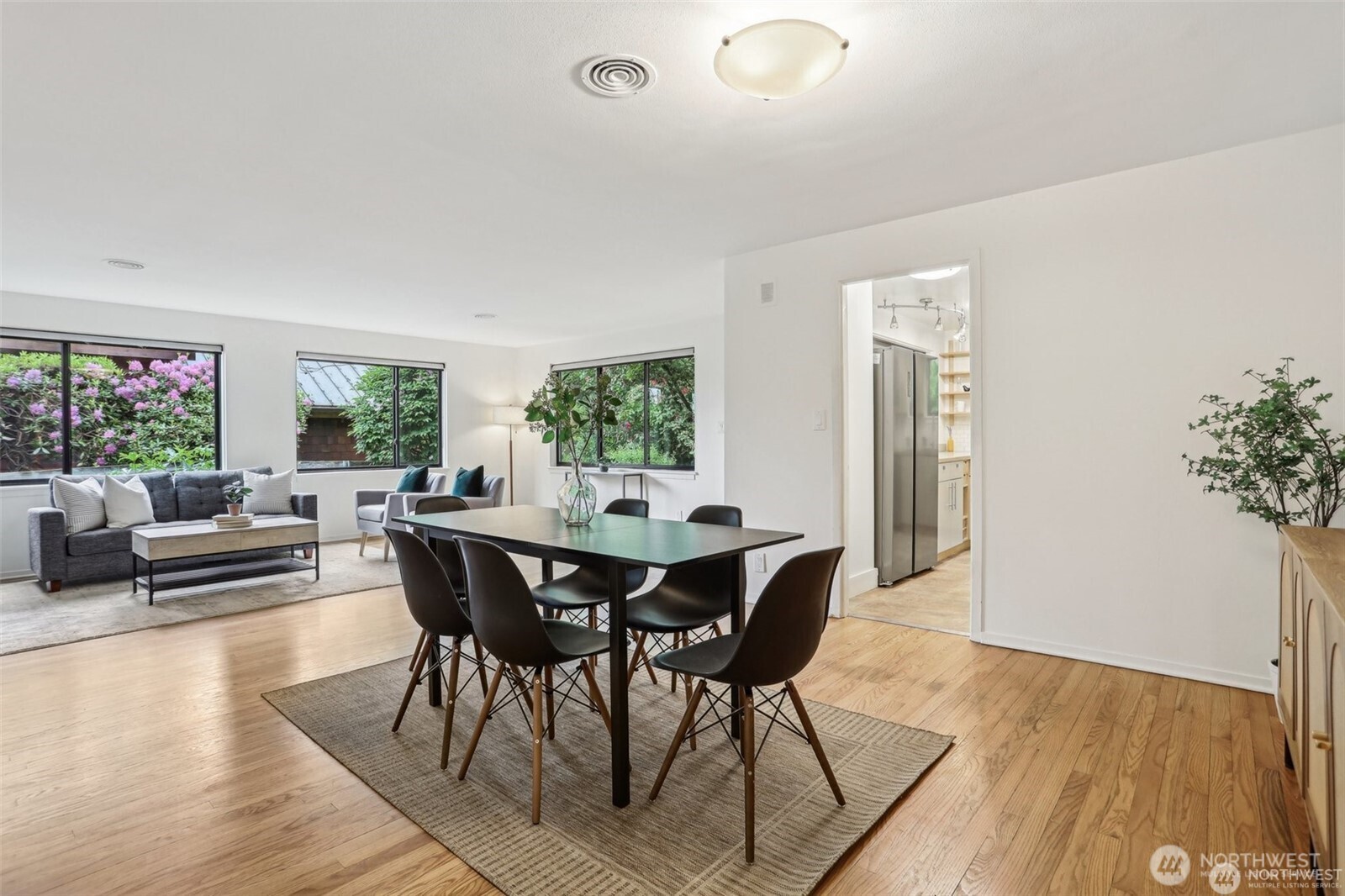 3532 Northeast 97th Street Seattle, WA 98115 - Photo 7 of 27 a view of a dining room with furniture window and wooden floor