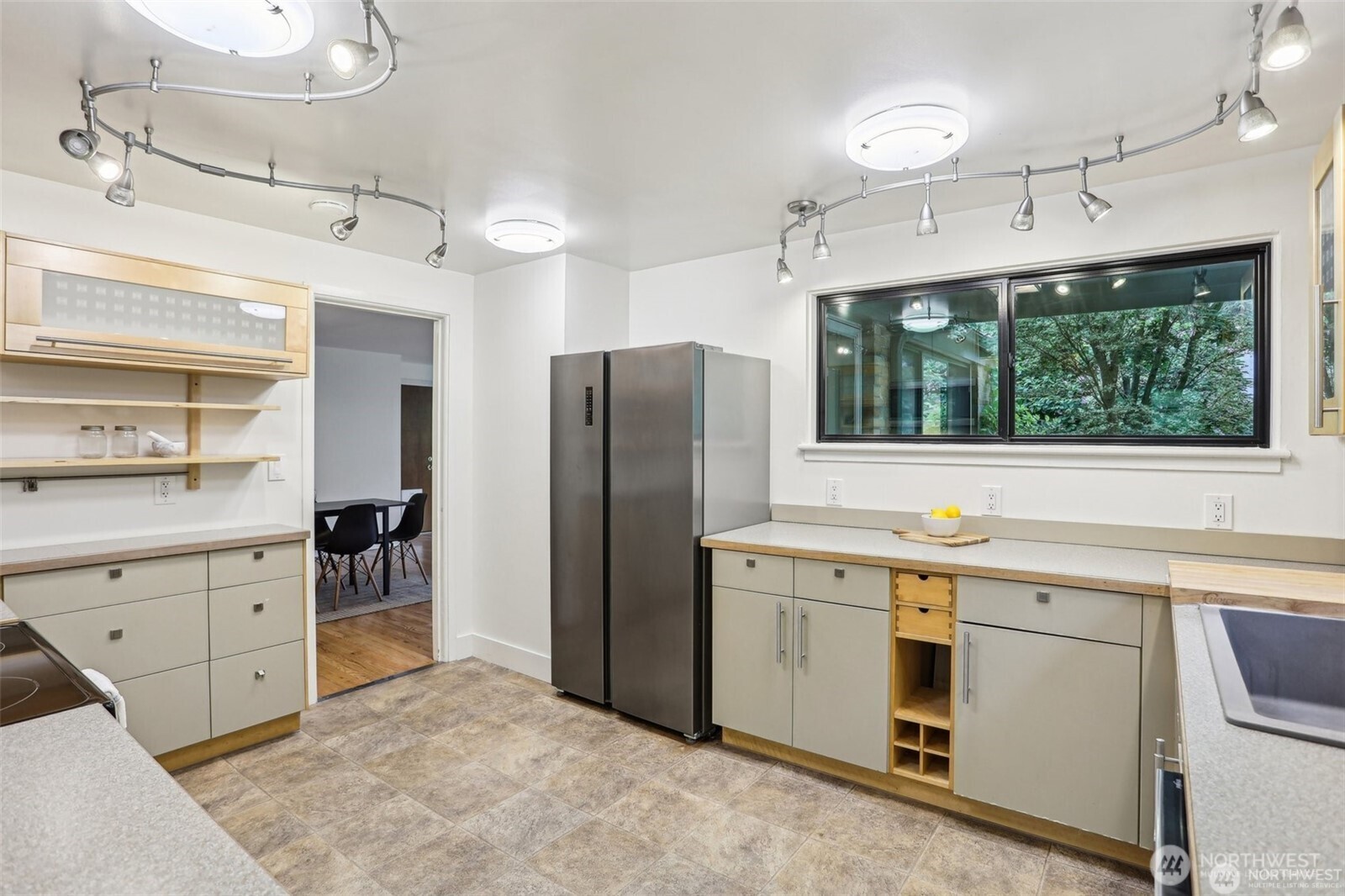 3532 Northeast 97th Street Seattle, WA 98115 - Photo 9 of 27 a kitchen with a stove a refrigerator and a sink