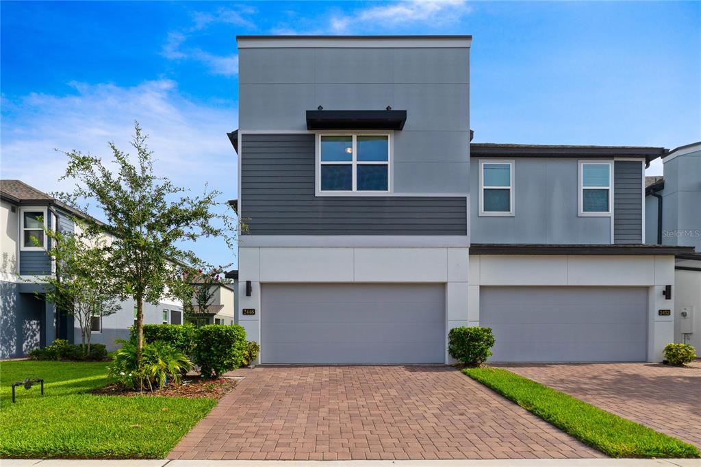 Welcome to the Enclave at Hawks Crest, a newly built GATED luxury townhome community in sought-after Winter Park, and this END-UNIT 3BD/2.5BA home with a bright open floor plan, UPGRADES throughout, HIGH CEILINGS, flex space and a large SCREENED LANAI!