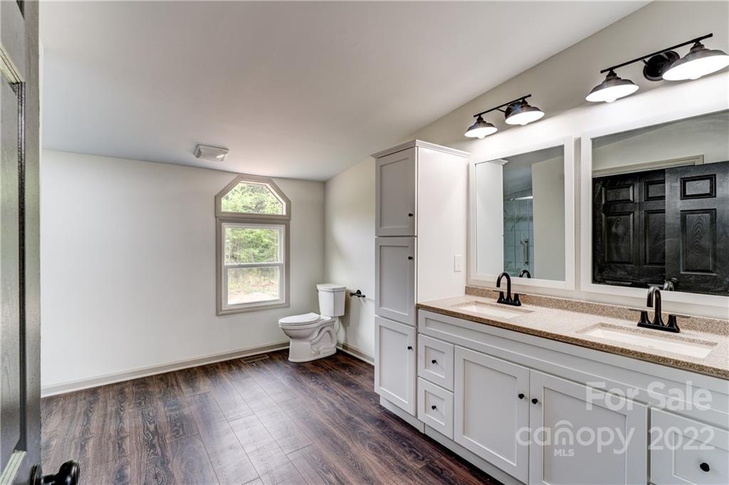 1569 Lawrence Road Clover, SC 29710 - Photo 16 of 26 a spacious bathroom with double vanity a window and a mirror
