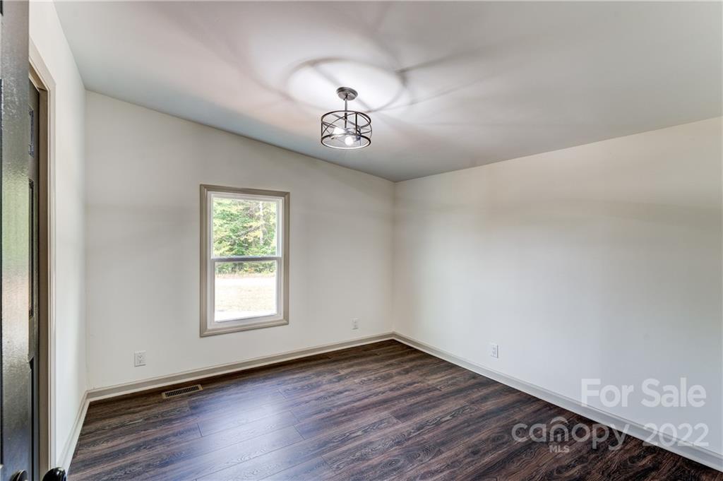 1569 Lawrence Road Clover, SC 29710 - Photo 19 of 26 wooden floor in an empty room with a window