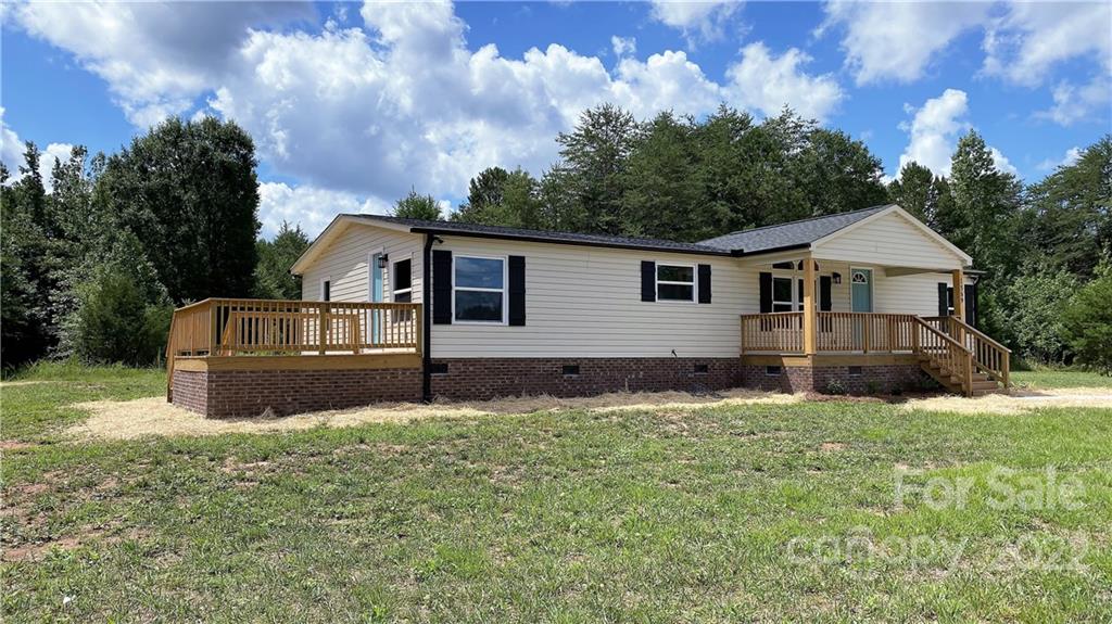 1569 Lawrence Road Clover, SC 29710 - Photo 3 of 26 a front view of a house with a garden