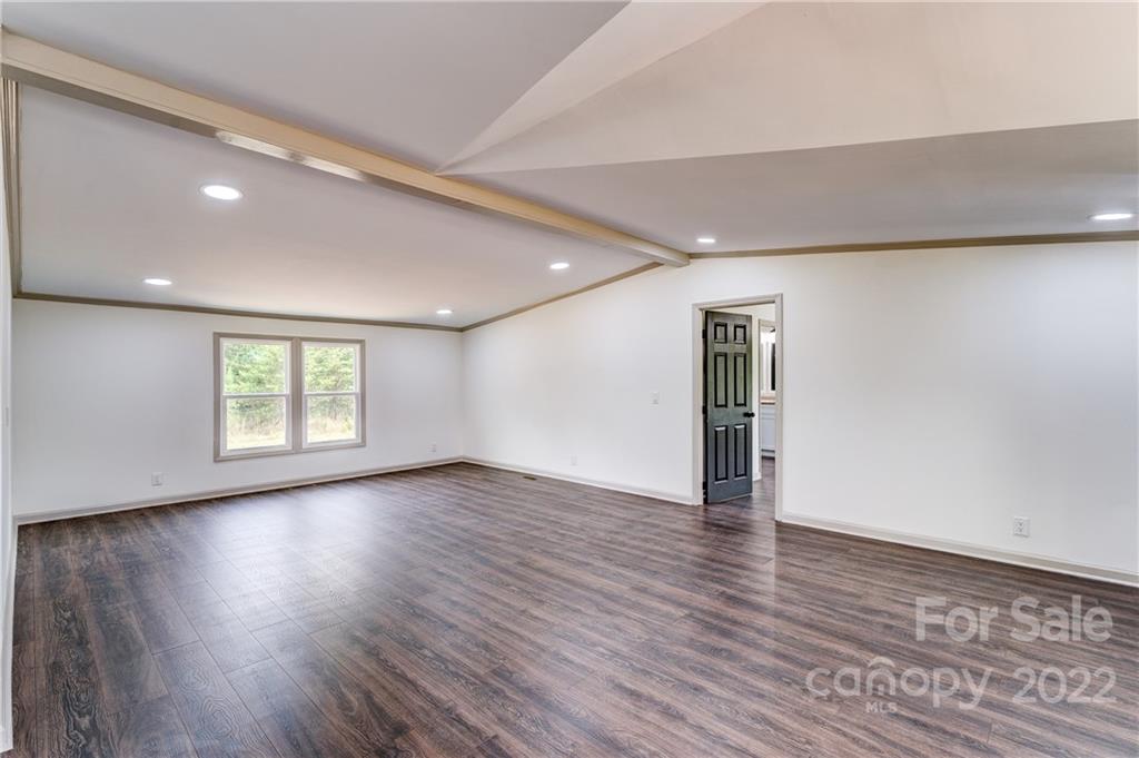 1569 Lawrence Road Clover, SC 29710 - Photo 5 of 26 a view of empty room with wooden floor and fan