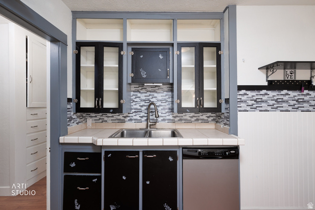 146 West 200 N Street Springville, UT 84663 - Photo 13 of 29 Kitchen area featuring a mosaic tile backsplash and a dual-basin stainless steel sink with a gooseneck faucet
