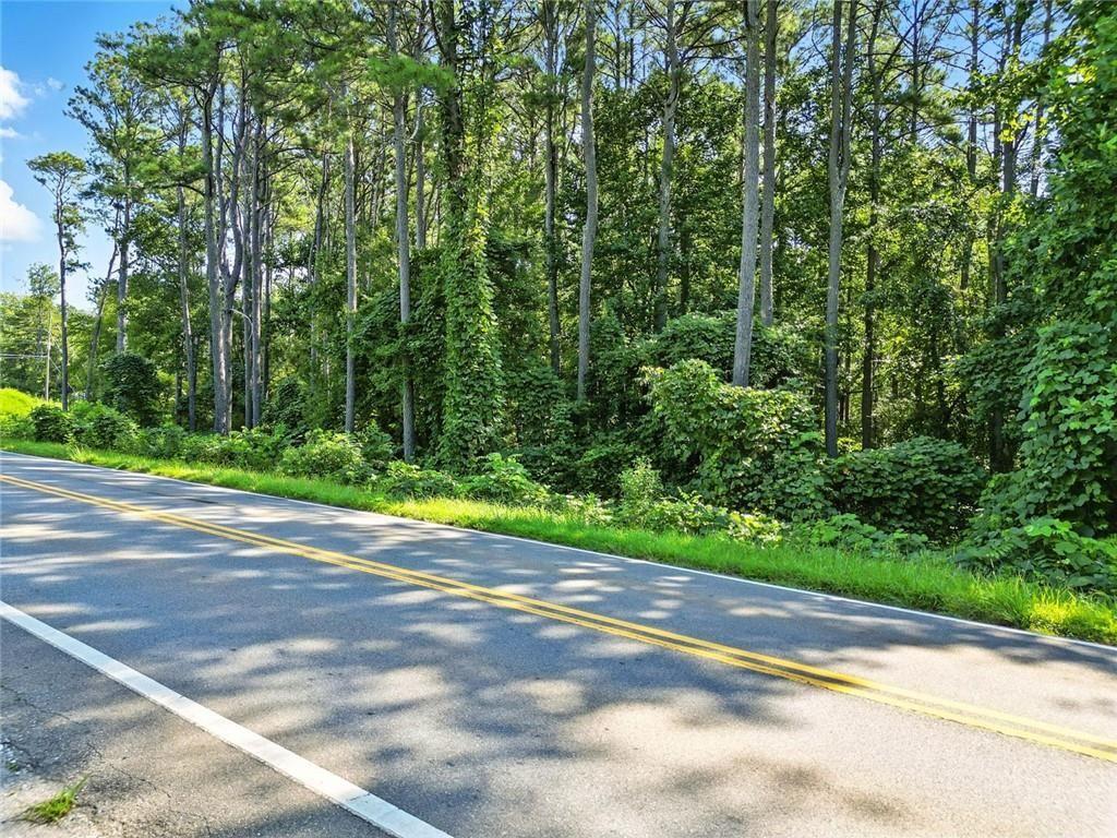 0 Fate Conn Road Canton, GA 30114 - Photo 7 of 12 a view of a yard with a house and large trees