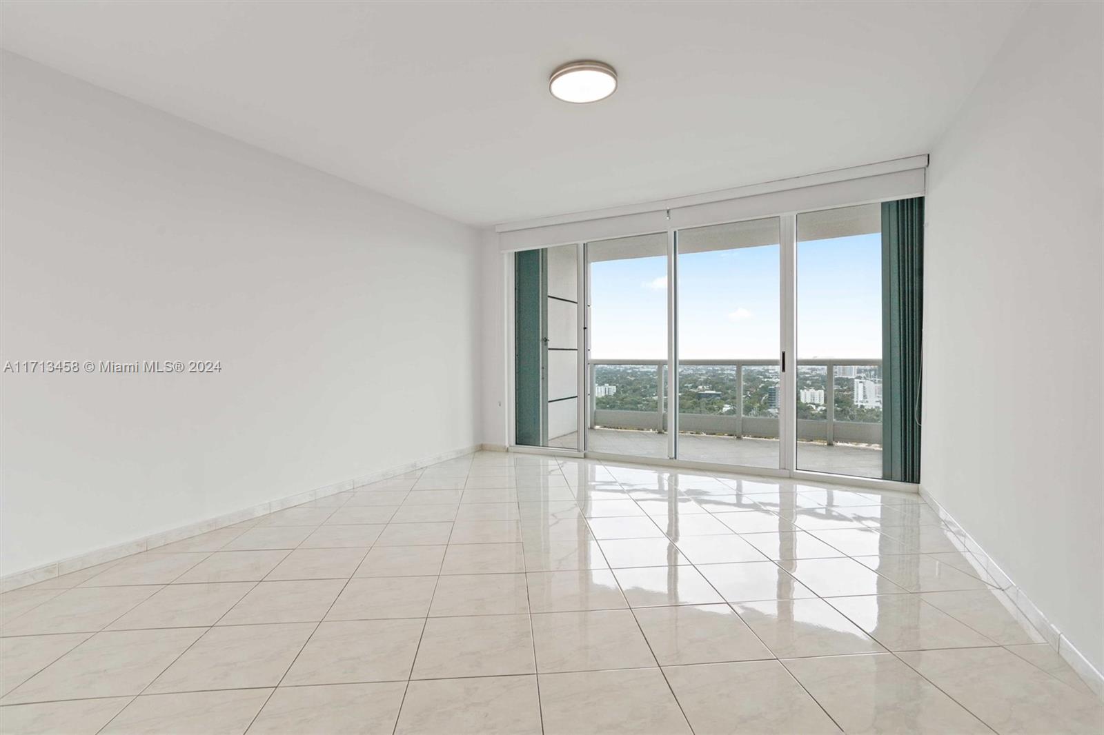 2127 Brickell Avenue, Unit 2804 Miami, FL 33129 - Photo 18 of 72 an empty room with windows and view of an empty room