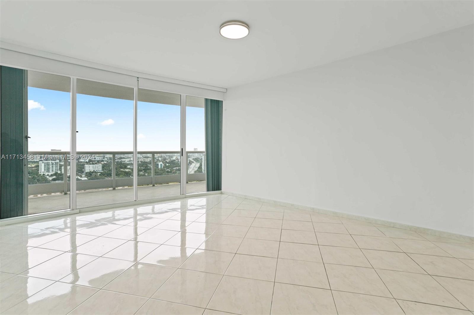 2127 Brickell Avenue, Unit 2804 Miami, FL 33129 - Photo 20 of 72 an empty room with windows and view of an empty room