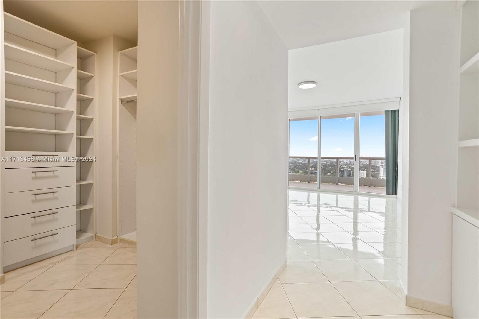 2127 Brickell Avenue, Unit 2804 Miami, FL 33129 - Photo 23 of 72 a view of walk in closet with empty racks