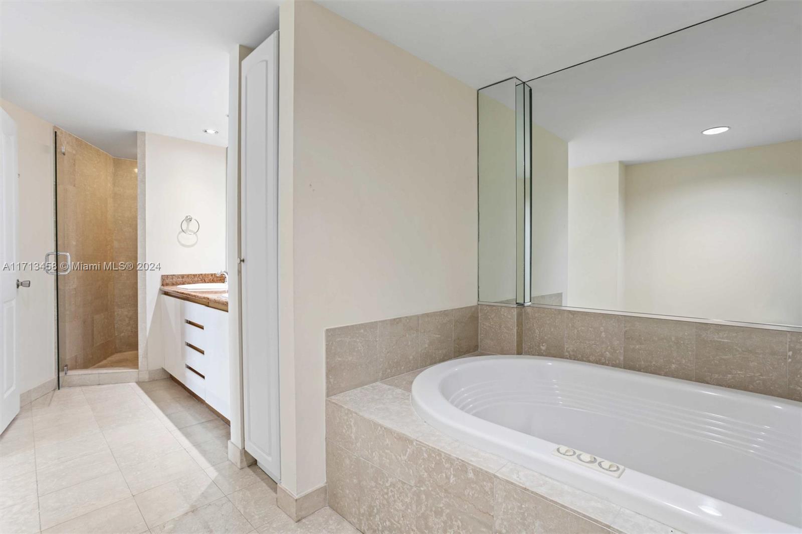 2127 Brickell Avenue, Unit 2804 Miami, FL 33129 - Photo 26 of 72 a bathroom with a bathtub and a double vanity sink