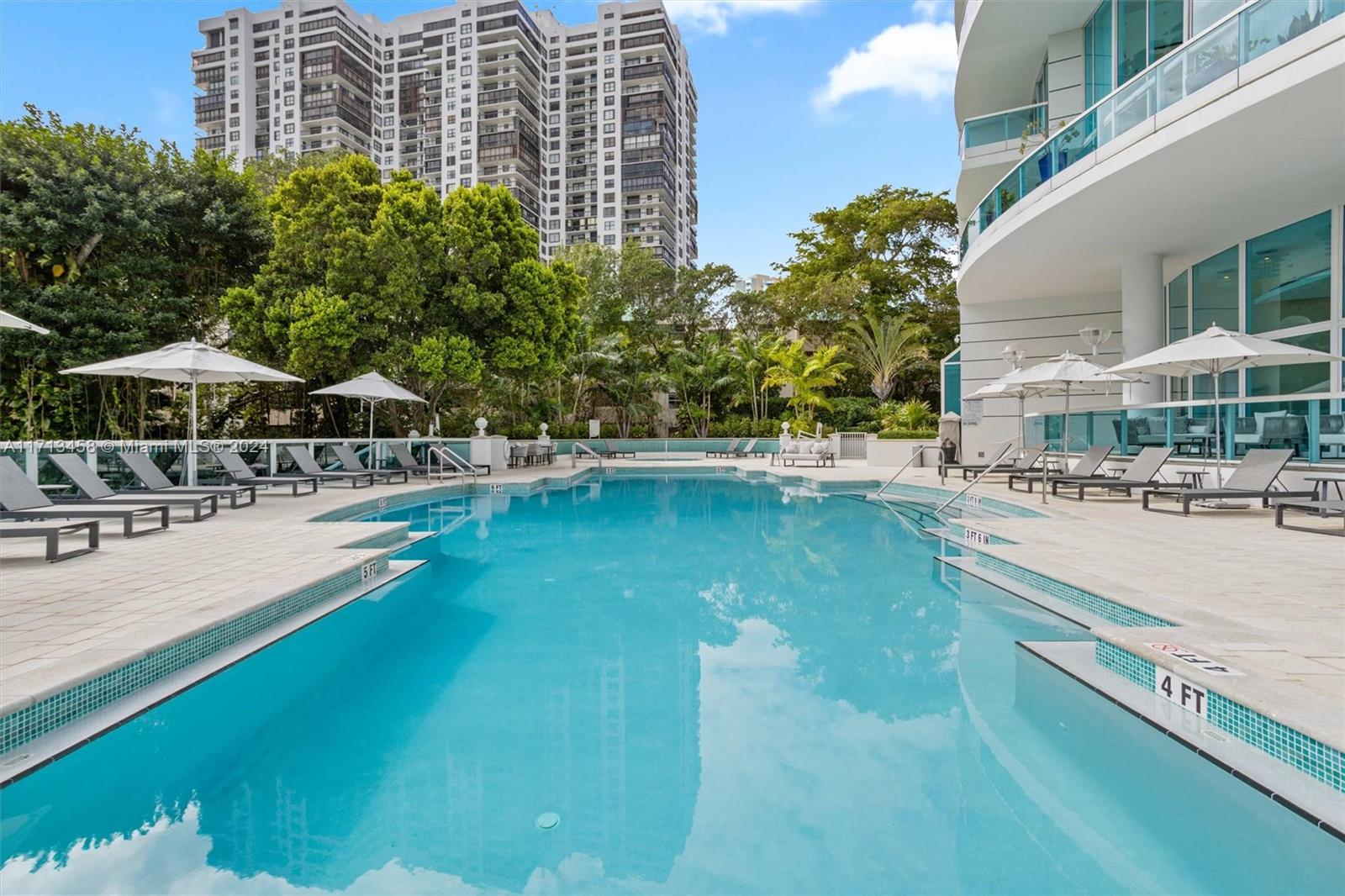 2127 Brickell Avenue, Unit 2804 Miami, FL 33129 - Photo 45 of 72 a swimming pool with outdoor seating and yard