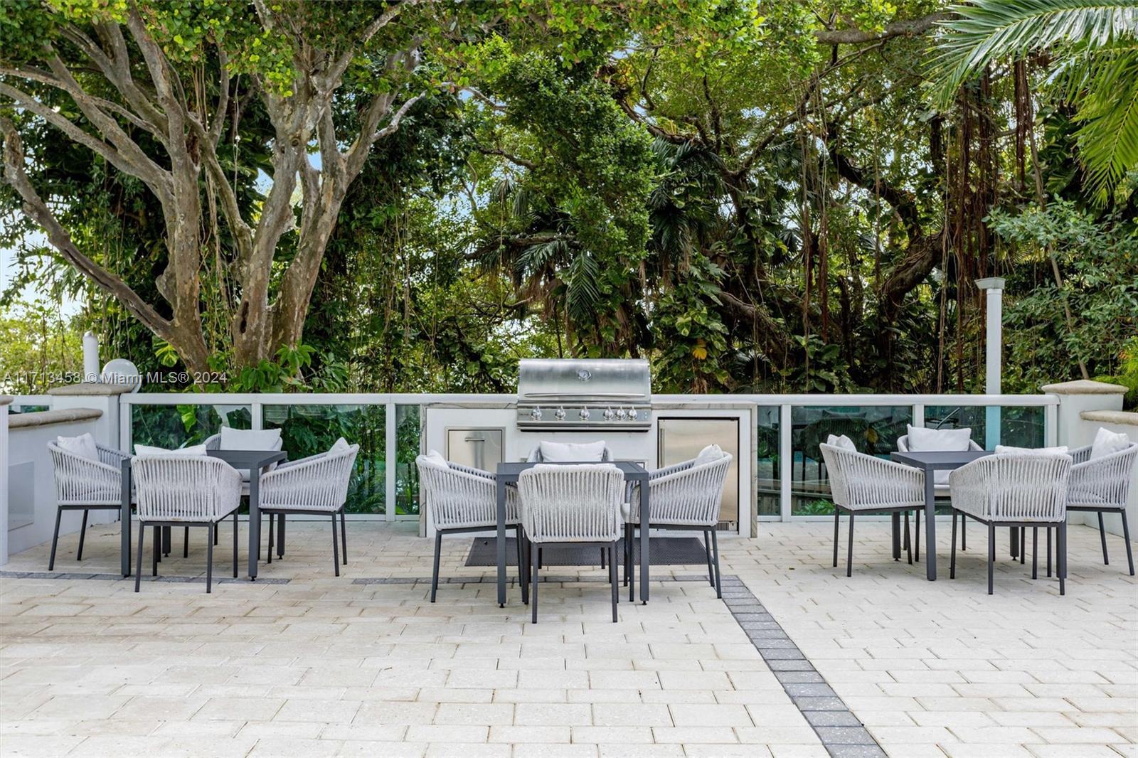 2127 Brickell Avenue, Unit 2804 Miami, FL 33129 - Photo 48 of 72 a chairs and a table in a patio